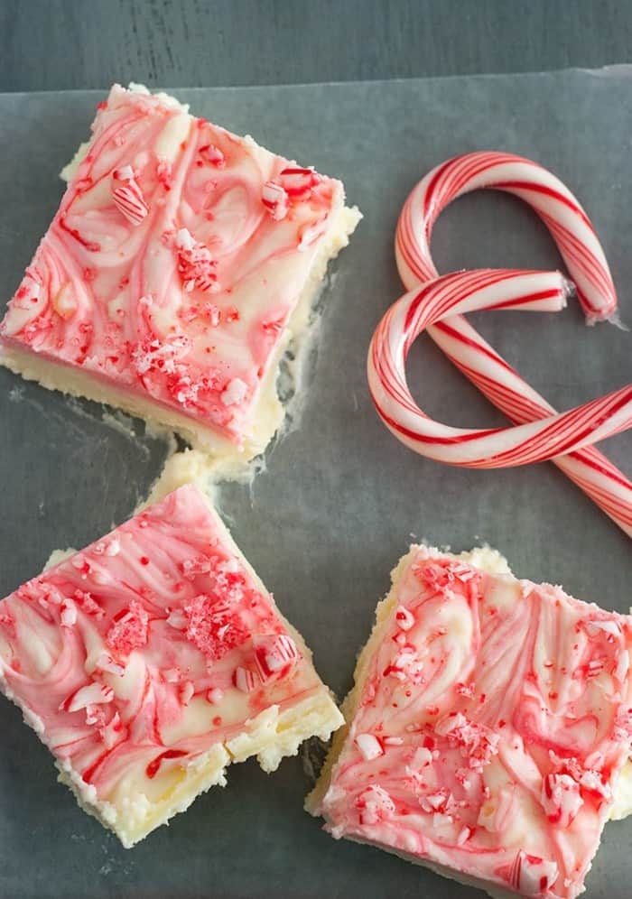 Velvety peppermint cheesecake bars with crunchy bits of candy cane on top. A holiday favorite dessert!