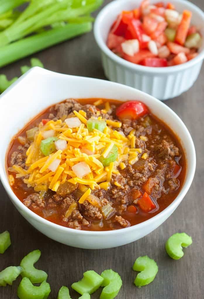 Low Carb Chili in bowl with celery and tomatoes.