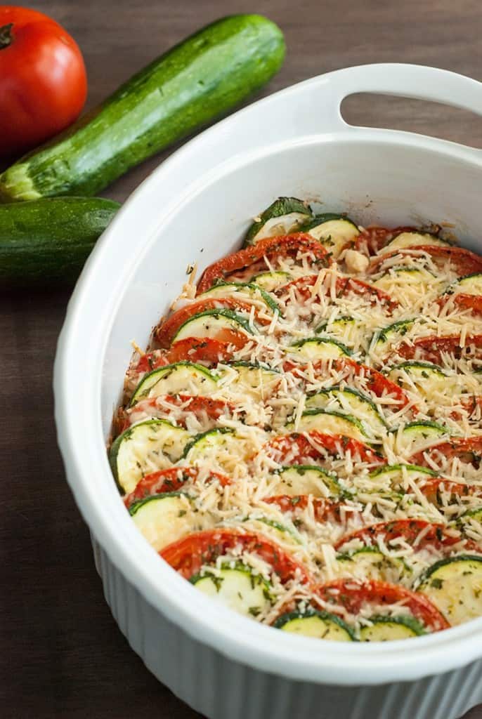 Fresh summer squash and zucchini are baked up with a crunchy Parmesan topping to make this easy and delicious low carb squash gratin recipe. 
