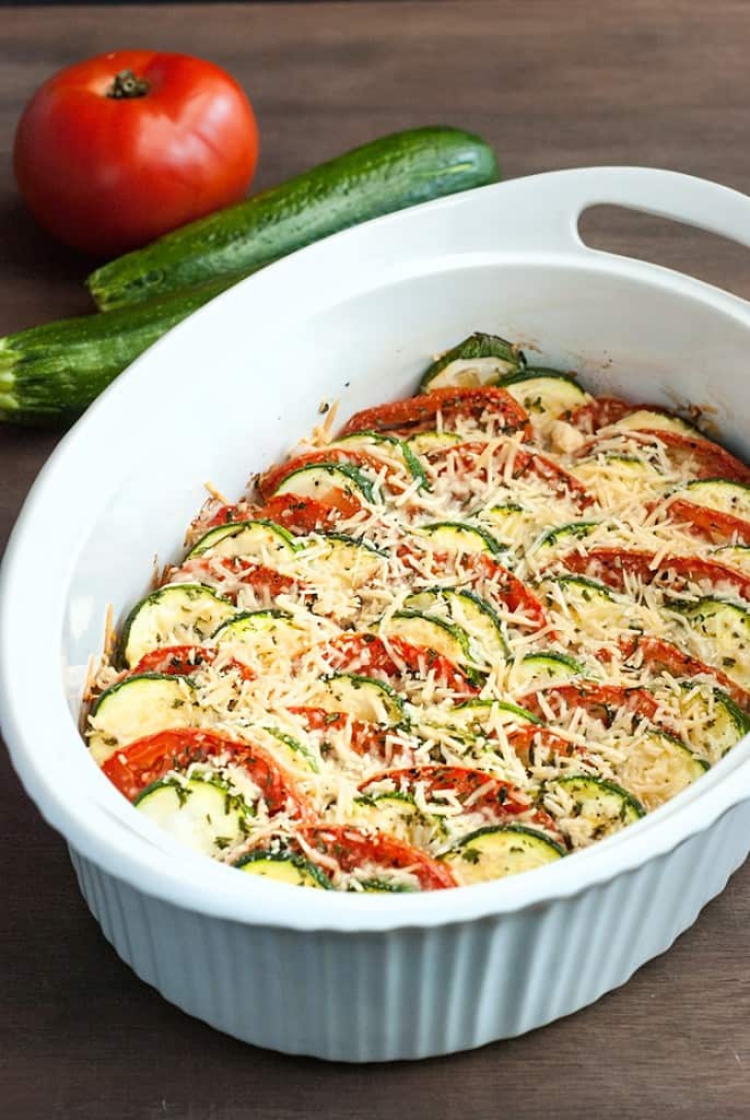 Fresh summer squash and zucchini are baked up with a crunchy Parmesan topping to make this easy and delicious low carb squash gratin recipe. 